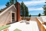 Walk Out the Master Bedroom to Private Deck with Outdoor Furniture and Water Views